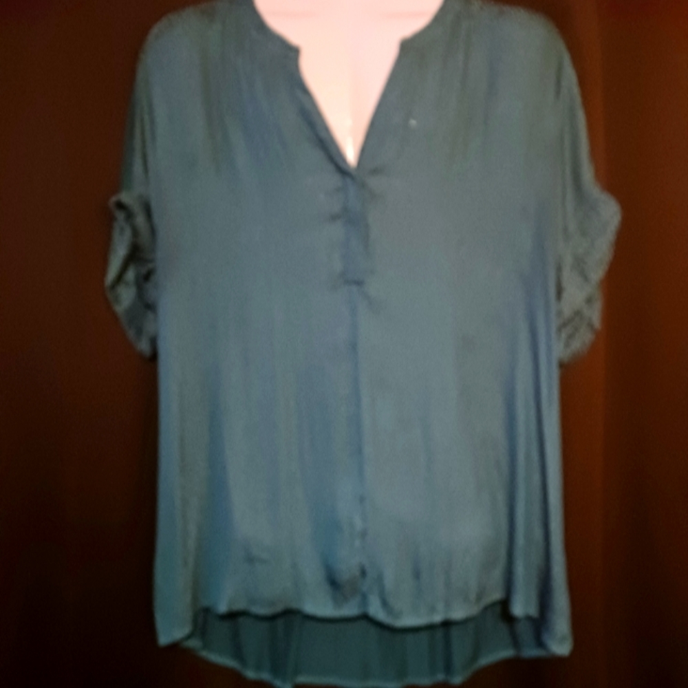 Printed turquoise and teal top. Printed front, sleeves, collar solid back.